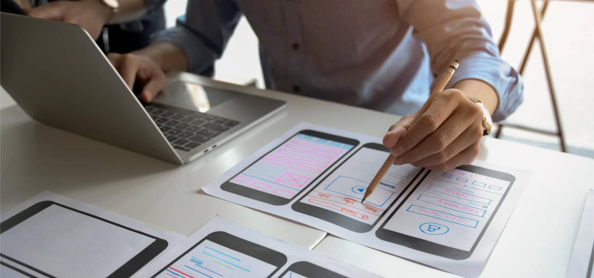 Close up view of UI graphic designer planing his smartphone template