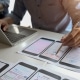 Close up view of UI graphic designer planing his smartphone template