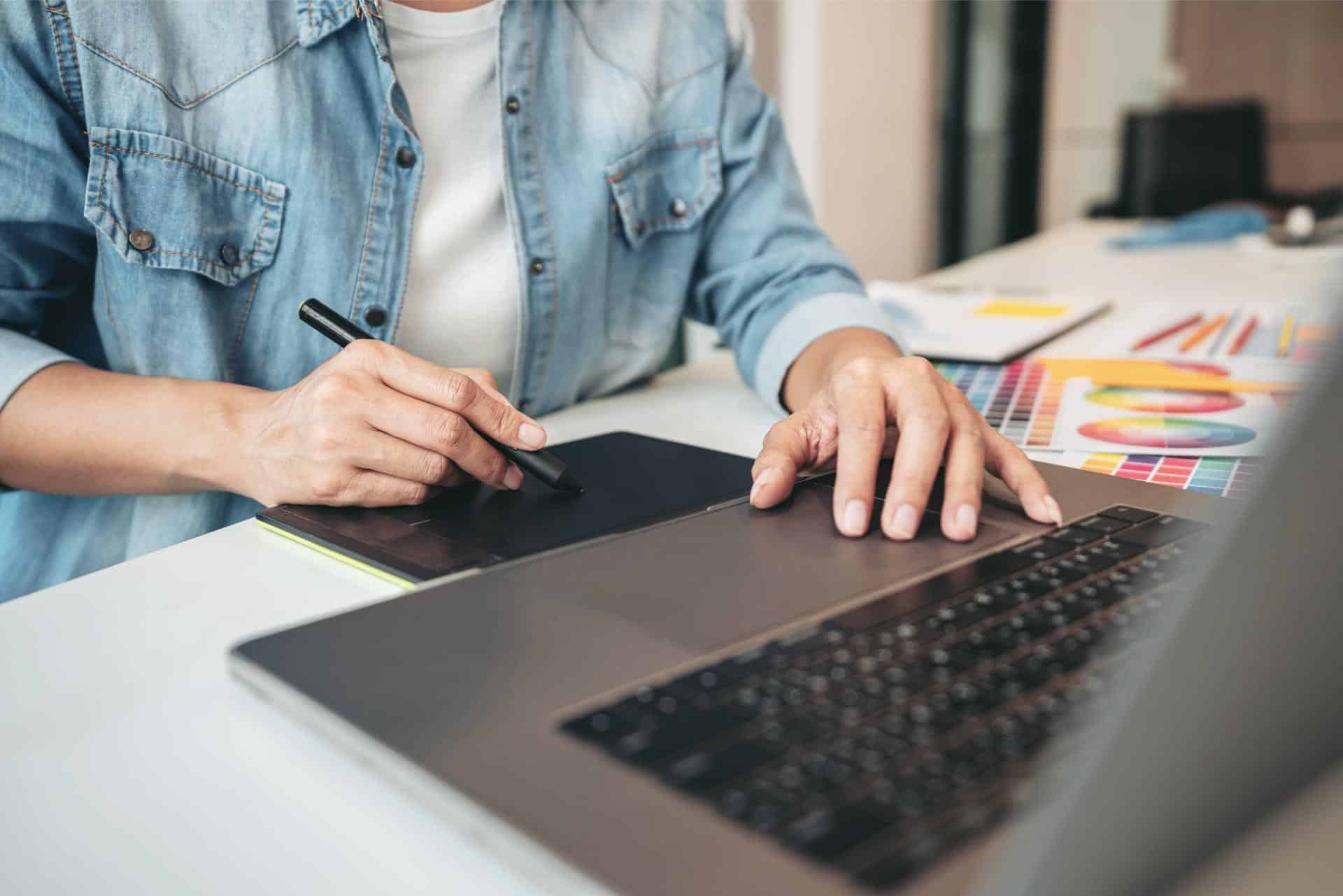 Young creative graphic designer working on color